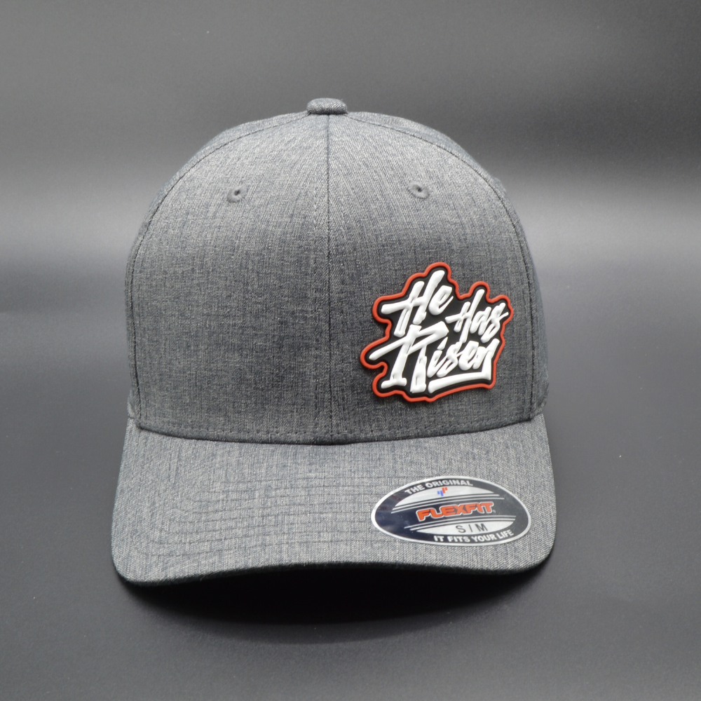 'HE HAS RISEN' FLEXFIT®  HEATHERLIGHT™ CAP